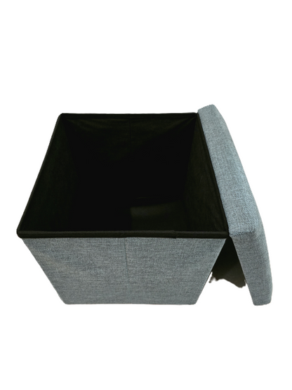 Pouf coffre de rangement ouvert montrant l'espace intérieur vide, structure solide et couvercle amovible en tissu pétrole chiné.