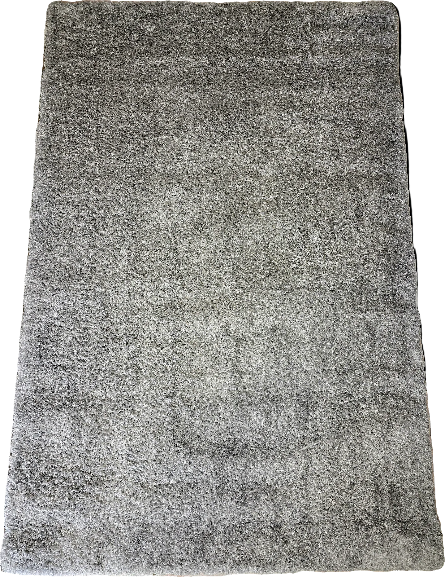 Grand tapis rectangulaire shaggy cocooning 100x150 cm, coloris gris apaisant avec poils longs denses et ultra-doux.